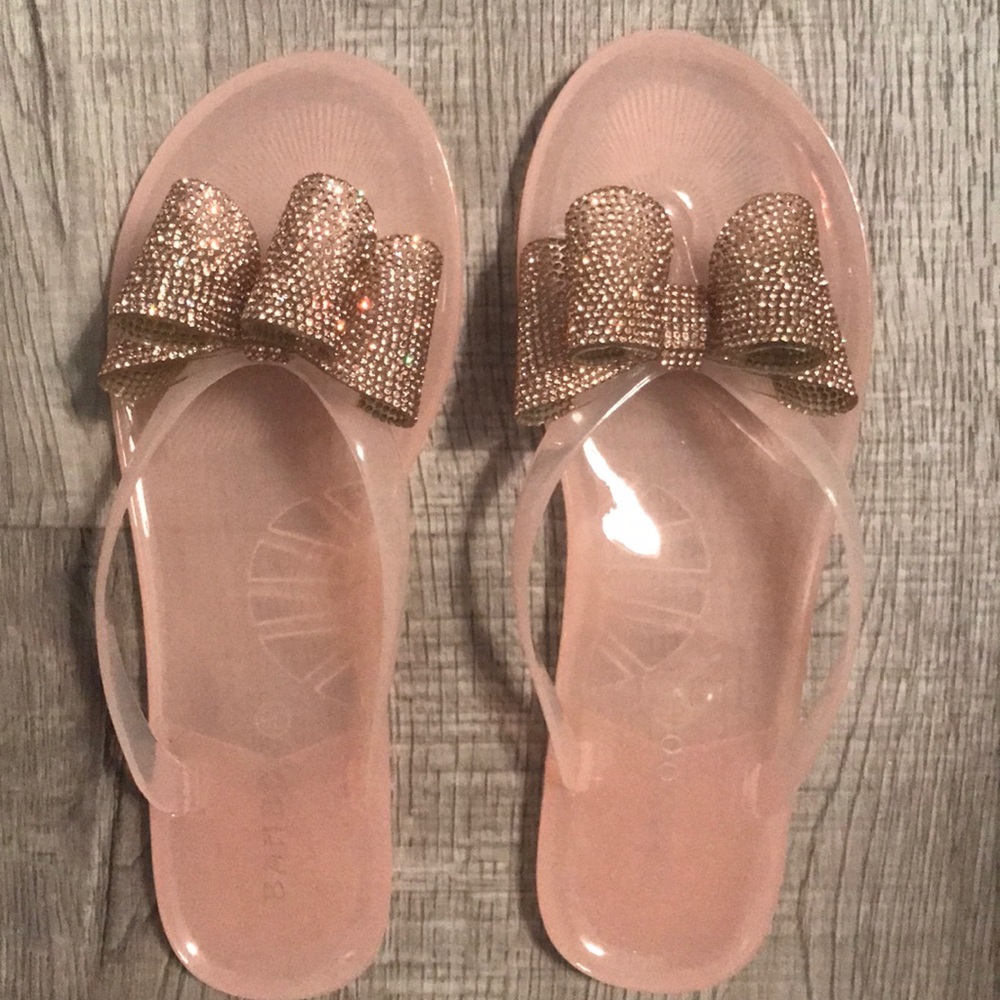 Brand new jelly sandals with bow.